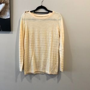 Pale yellow long sleeve top.